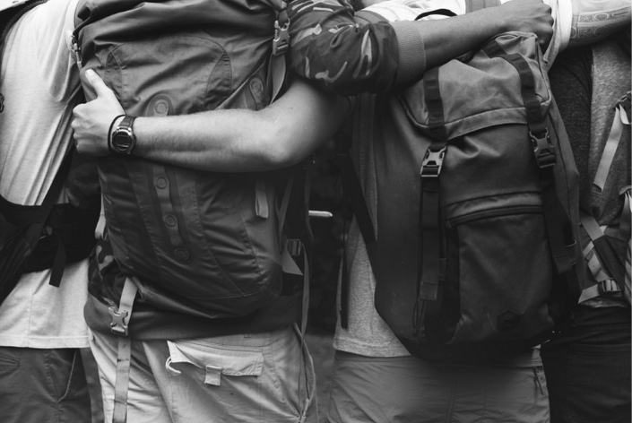Group of young adults in a group huddle